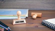 Shutterstock, Customs. Rubber Stamp on desk in the Office