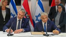 Prime Minister Lapid and Chancellor Nehammer signing the Strategic Partnership