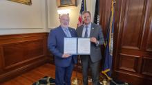 Governor Sununu of New Hampshire signs executive order (photo credit: MFA) Governor Sununu of New Hampshire signs executive order