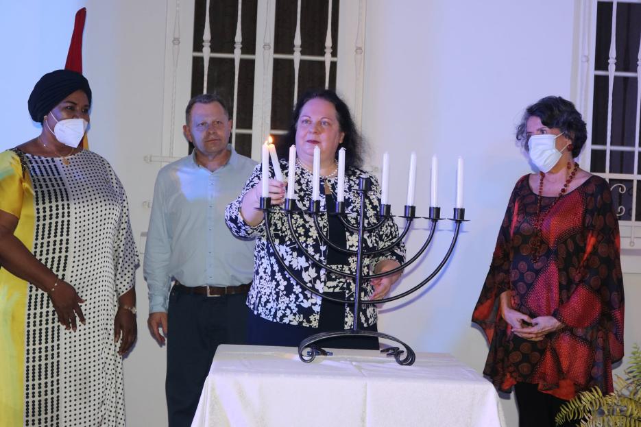 Lighting the Hanukkah Candles with Friends of the Embassy (photo credit: MFA Accra) Lighting the Hanukkah Candles with Friends of the Embassy