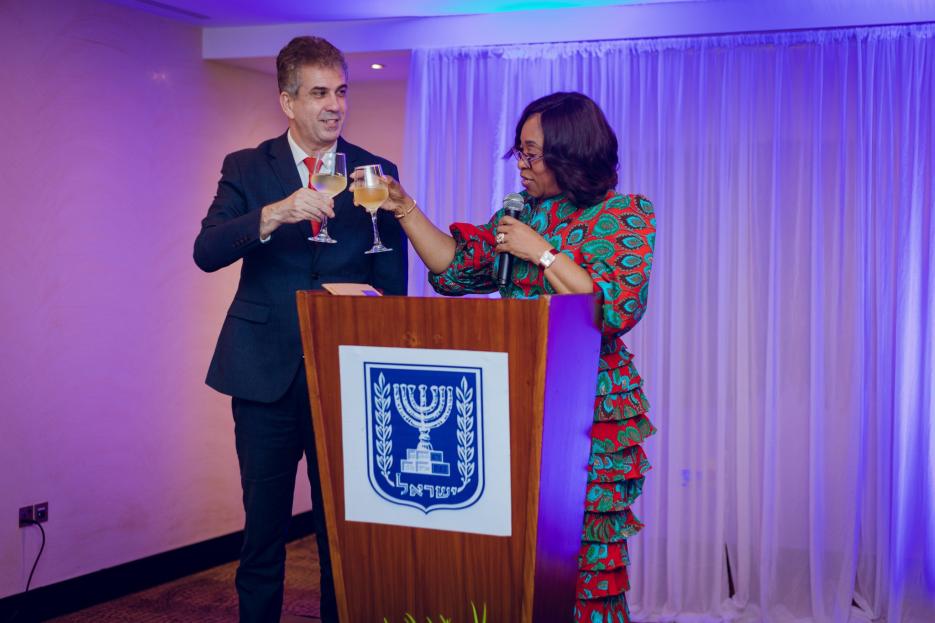 H.E. Cohen in a Toast with colleague Minister, Hon. Shirley Ayorkor Botchewy 