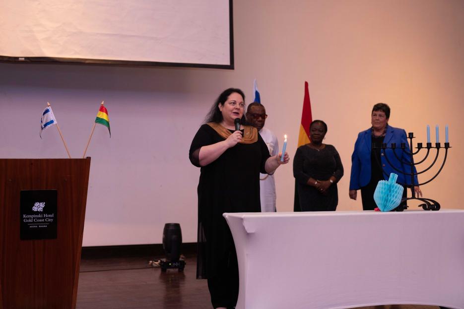 H. E. Shlomit Sufa Lighting Hanukkah Candle with US Ambassador to Ghana