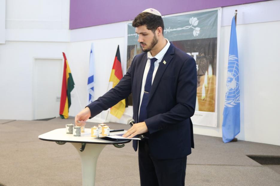 Mattan Biton Lighting Candles for the Holocaust Victims (photo credit: MFA Accra) Mattan Biton Lighting Candles for the Holocaust Victims