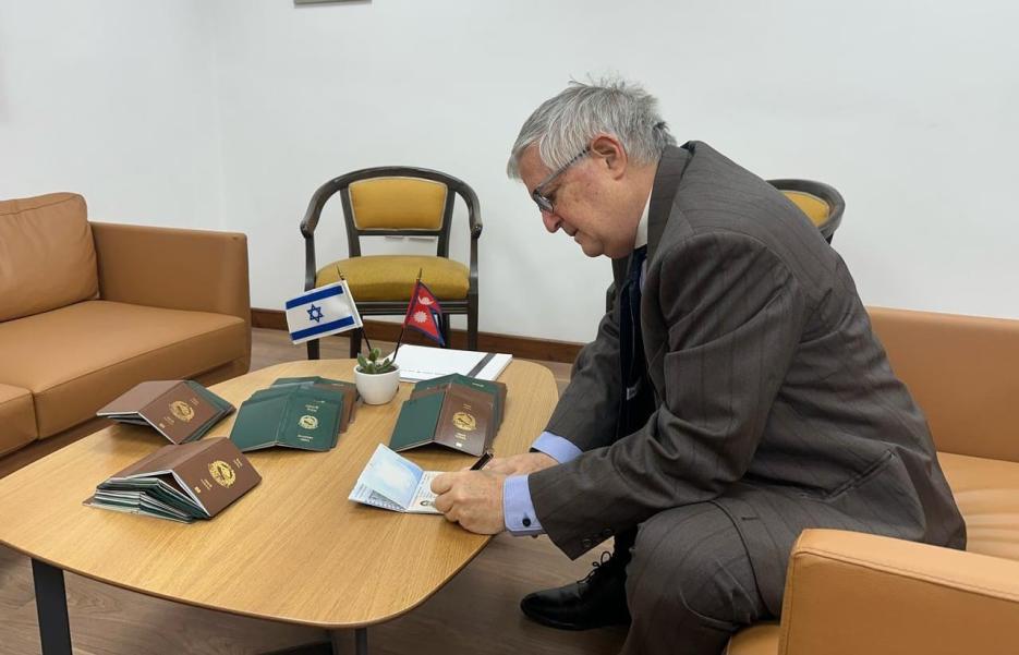 Ambassador issuing Visas (photo credit: Embassy of Israel in Nepal) Ambassador issuing Visas