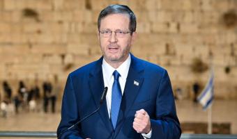 President Herzog broadcasting fron the Western Wall