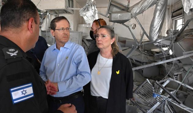 President Herzog visits site of Iranian missile attack