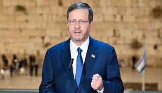 President Herzog broadcasting fron the Western Wall