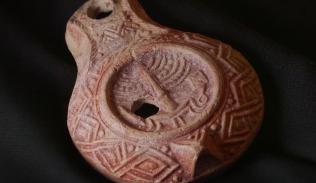 The rare 1,700-year-old oil lamp, decorated with Temple symbols