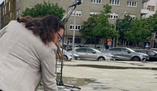 hadas dolev leaving pebble at holocaust memorial